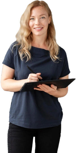 A woman smiling and holding a clipboard as a Graphic Design Assistant.
