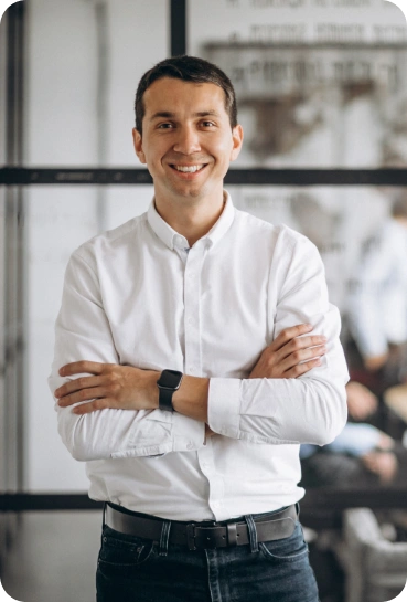 A man in an office showcasing a confident pose.